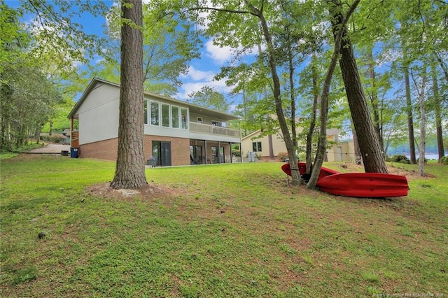 back of house featuring a yard