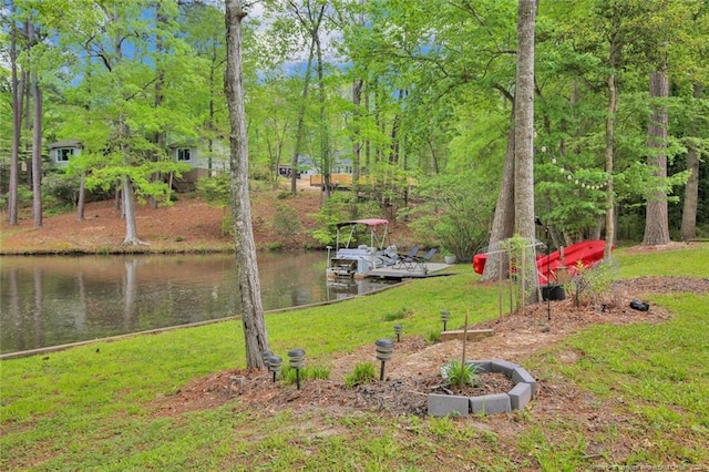 exterior space featuring a dock and a water view