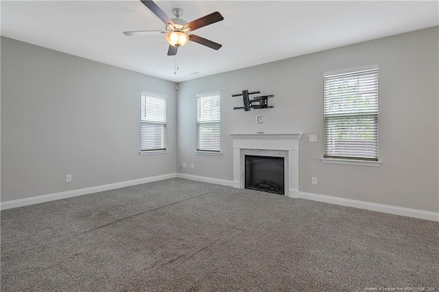 387 Springhaven Dr, Raeford, NC 28376 - unfurnished living room with a fireplace, ceiling fan, plenty of natural light, and baseboards