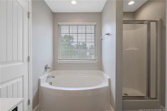 387 Springhaven Dr, Raeford, NC 28376 - full bathroom featuring a garden tub, a stall shower, and vanity