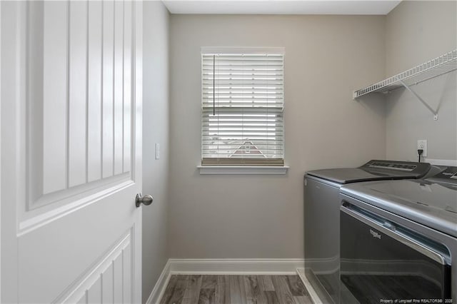 387 Springhaven Dr, Raeford, NC 28376 - washroom with separate washer and dryer, baseboards, and wood finished floors
