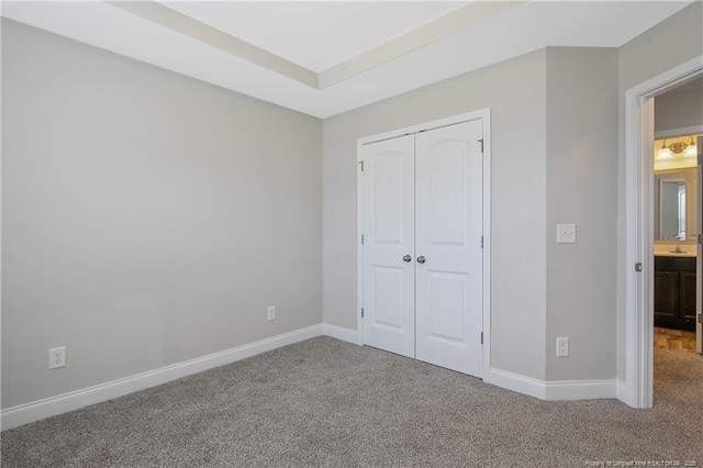 387 Springhaven Dr, Raeford, NC 28376 - unfurnished bedroom with carpet flooring, baseboards, and a closet