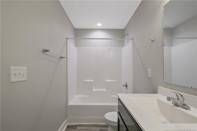 387 Springhaven Dr, Raeford, NC 28376 - full bath featuring toilet, vanity, shower / bathtub combination, wood finished floors, and baseboards