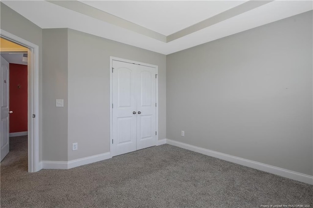 387 Springhaven Dr, Raeford, NC 28376 - unfurnished bedroom featuring carpet floors, baseboards, and a closet