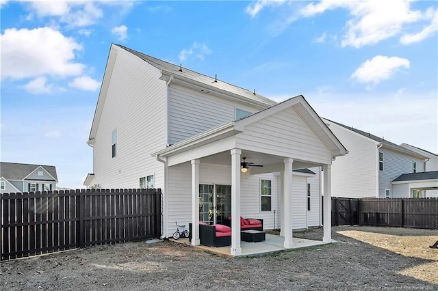 387 Springhaven Dr, Raeford, NC 28376 - back of house with ceiling fan, a fenced backyard, a patio, and an outdoor living space