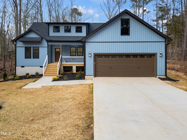 modern farmhouse style home with roof with shingles, covered porch, concrete driveway, an attached garage, and crawl space