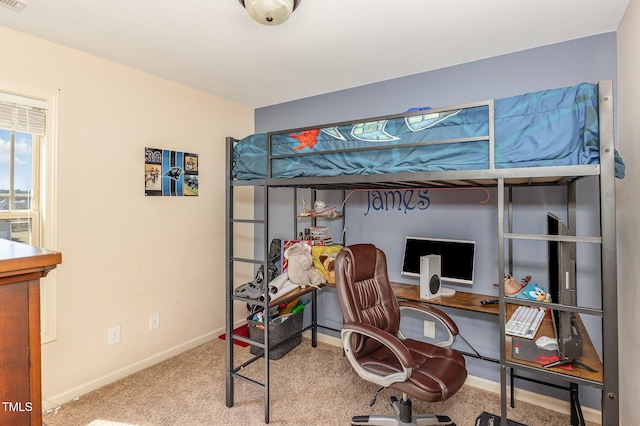 bedroom with carpet flooring and baseboards