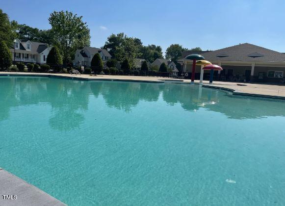 community pool featuring a patio area