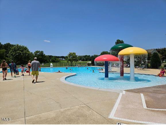 pool featuring a patio and fence