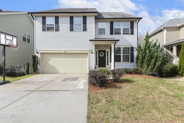 traditional home with a front yard, concrete driveway, and an attached garage