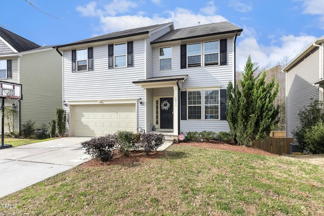 traditional-style home with a garage, a front yard, driveway, and fence