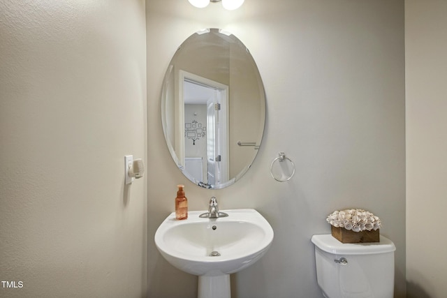 bathroom with toilet and a sink