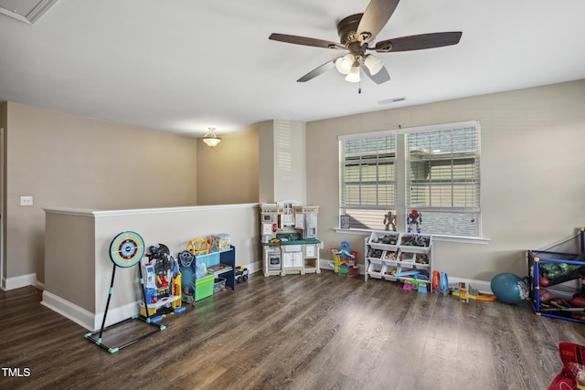 game room with visible vents, wood finished floors, baseboards, and ceiling fan