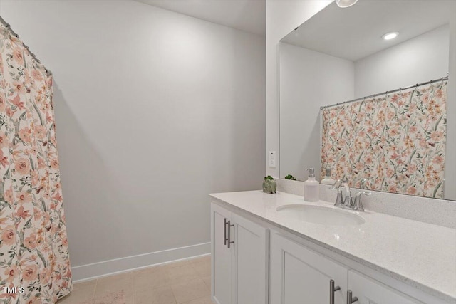 bathroom featuring vanity and baseboards