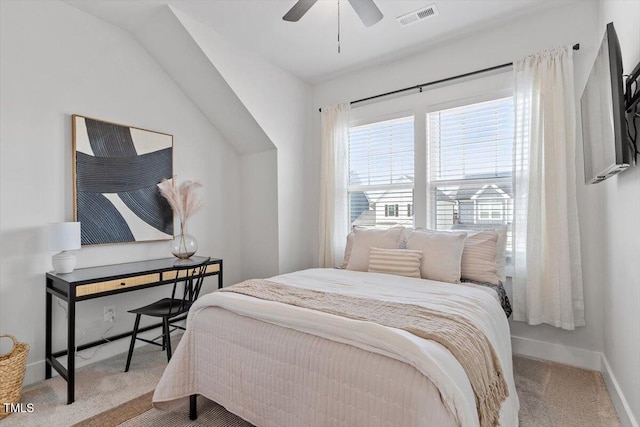 carpeted bedroom with baseboards, visible vents, and ceiling fan