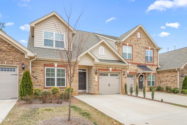 view of front of home featuring brick siding, driveway, and roof with shingles