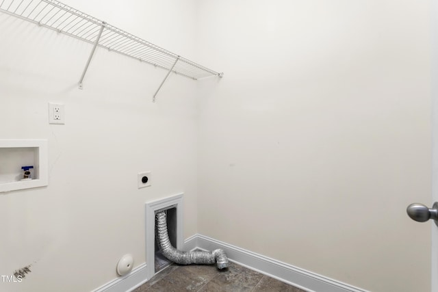 clothes washing area with baseboards, gas dryer hookup, washer hookup, laundry area, and hookup for an electric dryer