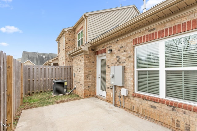 view of patio featuring central AC unit and a fenced backyard