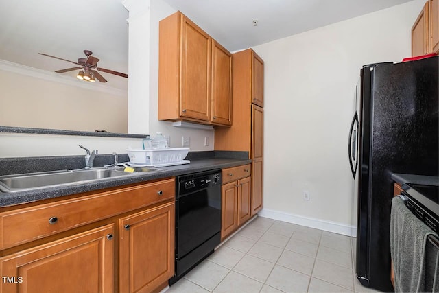 kitchen with light tile patterned floors, a sink, black appliances, brown cabinetry, and dark countertops