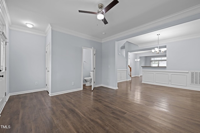 unfurnished living room featuring dark wood-style floors, crown molding, visible vents, baseboards, and ceiling fan with notable chandelier