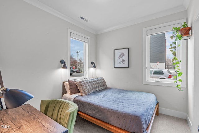 bedroom featuring visible vents, baseboards, crown molding, and carpet