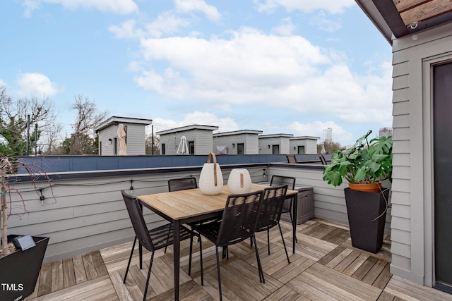 wooden terrace featuring outdoor dining area