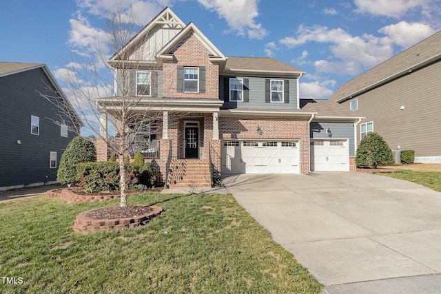 view of front of house featuring a porch, a front yard, brick siding, and driveway