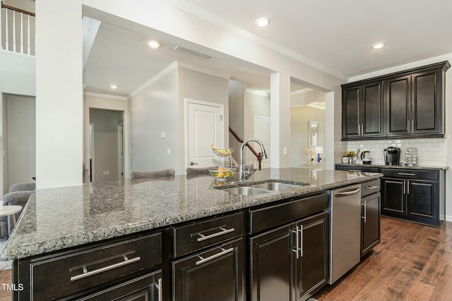 kitchen featuring visible vents, dark wood-style floors, crown molding, stone counters, and a sink