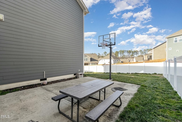 exterior space with a lawn, a fenced backyard, and a residential view