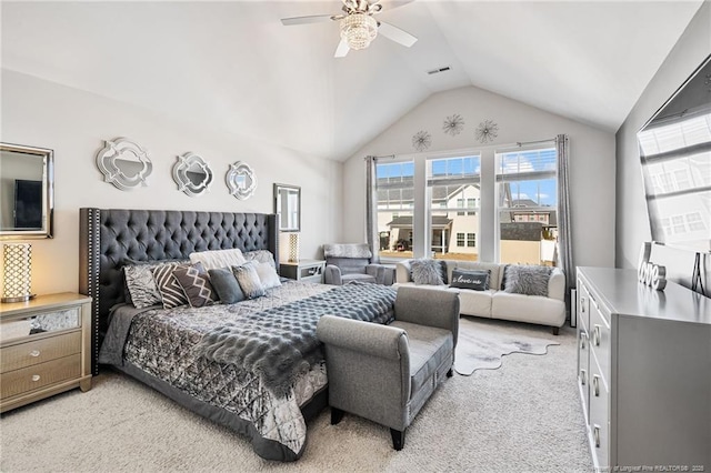 bedroom with a ceiling fan, lofted ceiling, light carpet, and visible vents