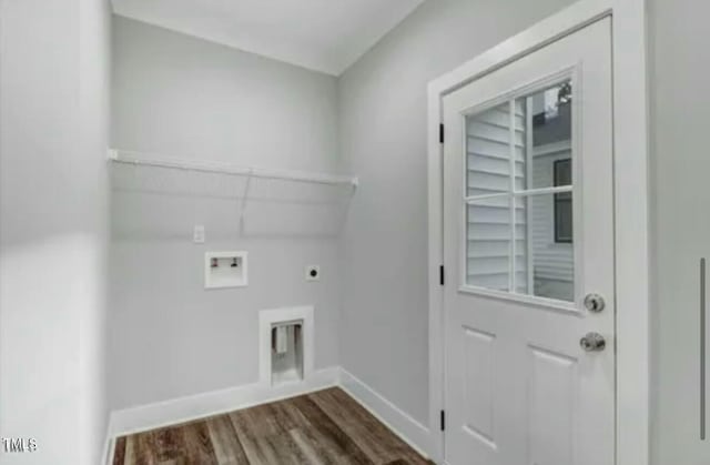 laundry area with hookup for a washing machine, dark wood-type flooring, electric dryer hookup, laundry area, and baseboards