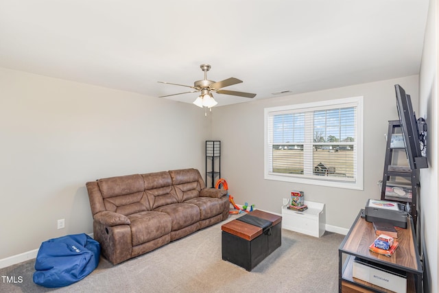 living area with ceiling fan, carpet, visible vents, and baseboards