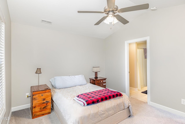 carpeted bedroom with ceiling fan, baseboards, visible vents, and vaulted ceiling