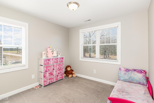 interior space featuring carpet flooring, visible vents, and baseboards