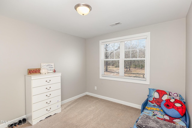 bedroom featuring light colored carpet, visible vents, and baseboards