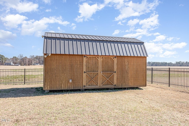 view of shed with a fenced backyard