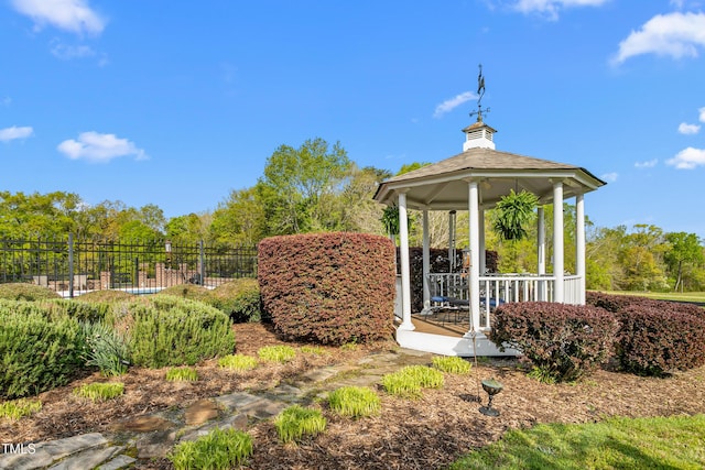 exterior space featuring a gazebo and fence