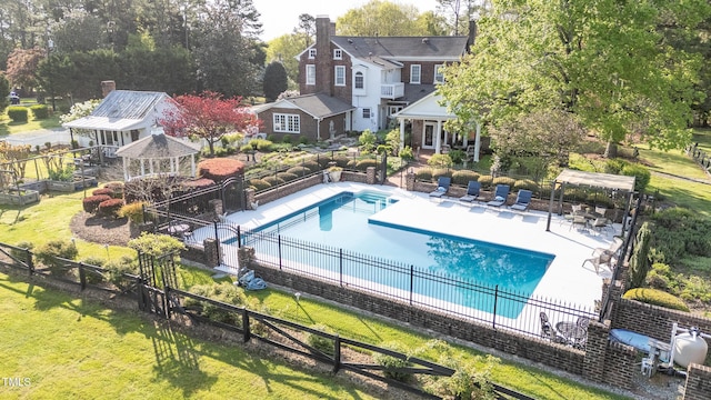 view of swimming pool featuring a fenced in pool, a yard, a patio area, a gazebo, and fence