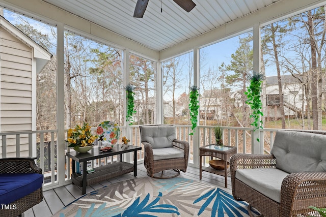 sunroom / solarium with ceiling fan