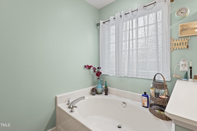 bathroom with a garden tub