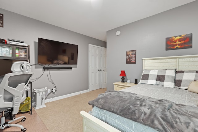 bedroom featuring baseboards and a closet