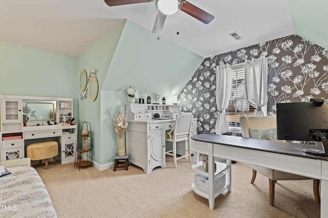 office area with visible vents, a ceiling fan, baseboards, carpet, and lofted ceiling