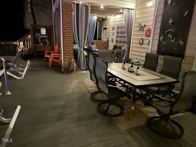 dining area with wood-type flooring