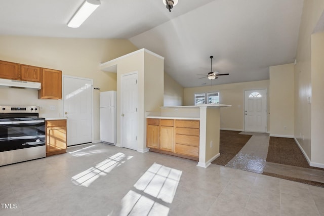 kitchen with light countertops, electric range, freestanding refrigerator, and under cabinet range hood