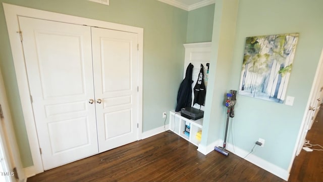 mudroom featuring ornamental molding, wood finished floors, and baseboards