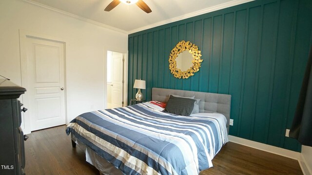 bedroom featuring ornamental molding, ceiling fan, baseboards, and wood finished floors