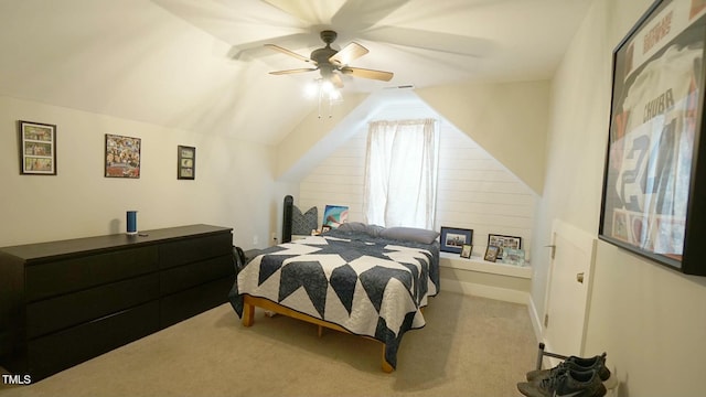 bedroom featuring lofted ceiling, a ceiling fan, visible vents, and carpet flooring