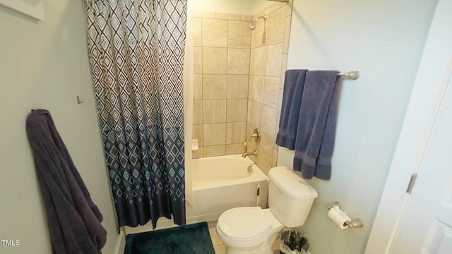 bathroom featuring shower / bath combination with curtain and toilet