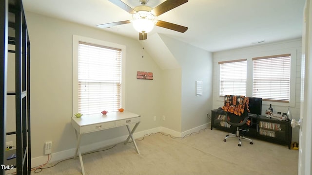 carpeted office space with visible vents and baseboards