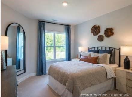 bedroom featuring carpet and baseboards